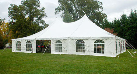 40-foot by 60-foot pole tent with white canopy and windowed sidewalls