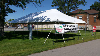 pole tent and canopy set up for an outdoor event